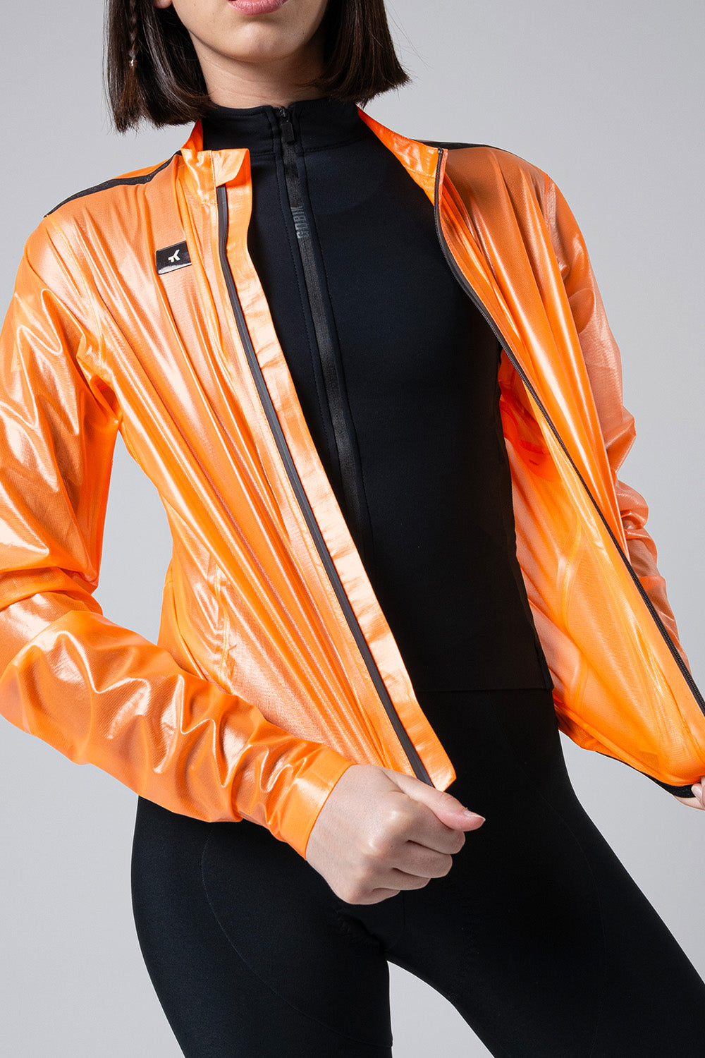 10-05-009-002-lightweight-rain-jacket-pluvia-2-0-women-blazing-orange-02